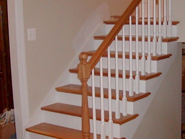 Custom built steps and railing with red oak flooring