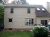 Exterior of house after remodel.  Bay nook was taken out and a casement window added.  Smaller window was taken out in the center and a triple window was added on the right.