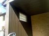New exterior wall on church porch with glass block window.  Wall is designed to control sound from large chiller unit (A/C) below.