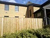 New windows, wrapped trim, new gutters, sound control wall, and new 8� tall fence.